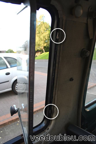 Metal clips holding the 1/4 window frame to body of the van